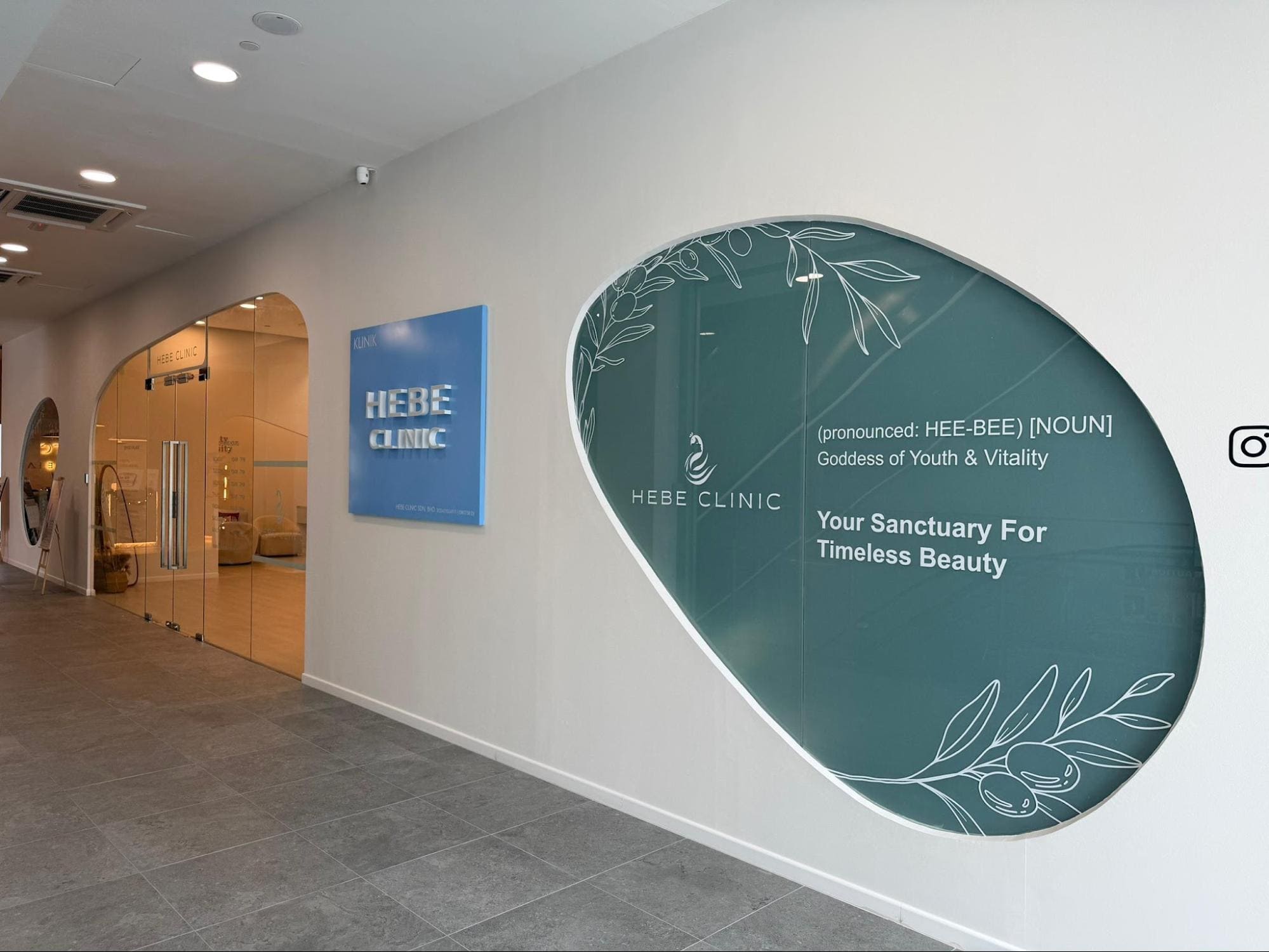 Hebe Clinic's entrance and branded hallway wall design